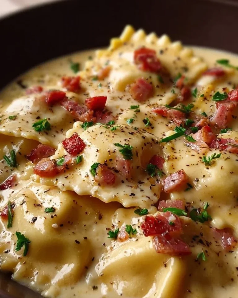 Delicious Olive Garden Ravioli Carbonara topped with creamy sauce and crispy pancetta.